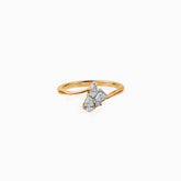 Gold ring with three pear-shaped diamonds clustered together on a curved band