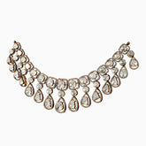Elegant diamond statement necklace with teardrop and square-cut stones in gold setting
