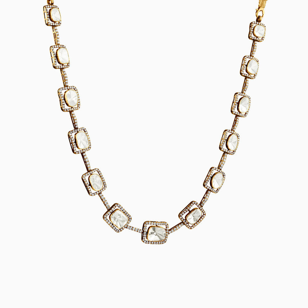 Gold necklace with square white stones and diamond-like border, elegant and delicate design.