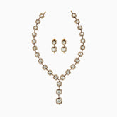 Elegant gold necklace and earring set with diamond-like stones in square and round settings
