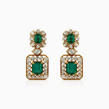 Emerald and diamond drop earrings in gold, ornate vintage-inspired design