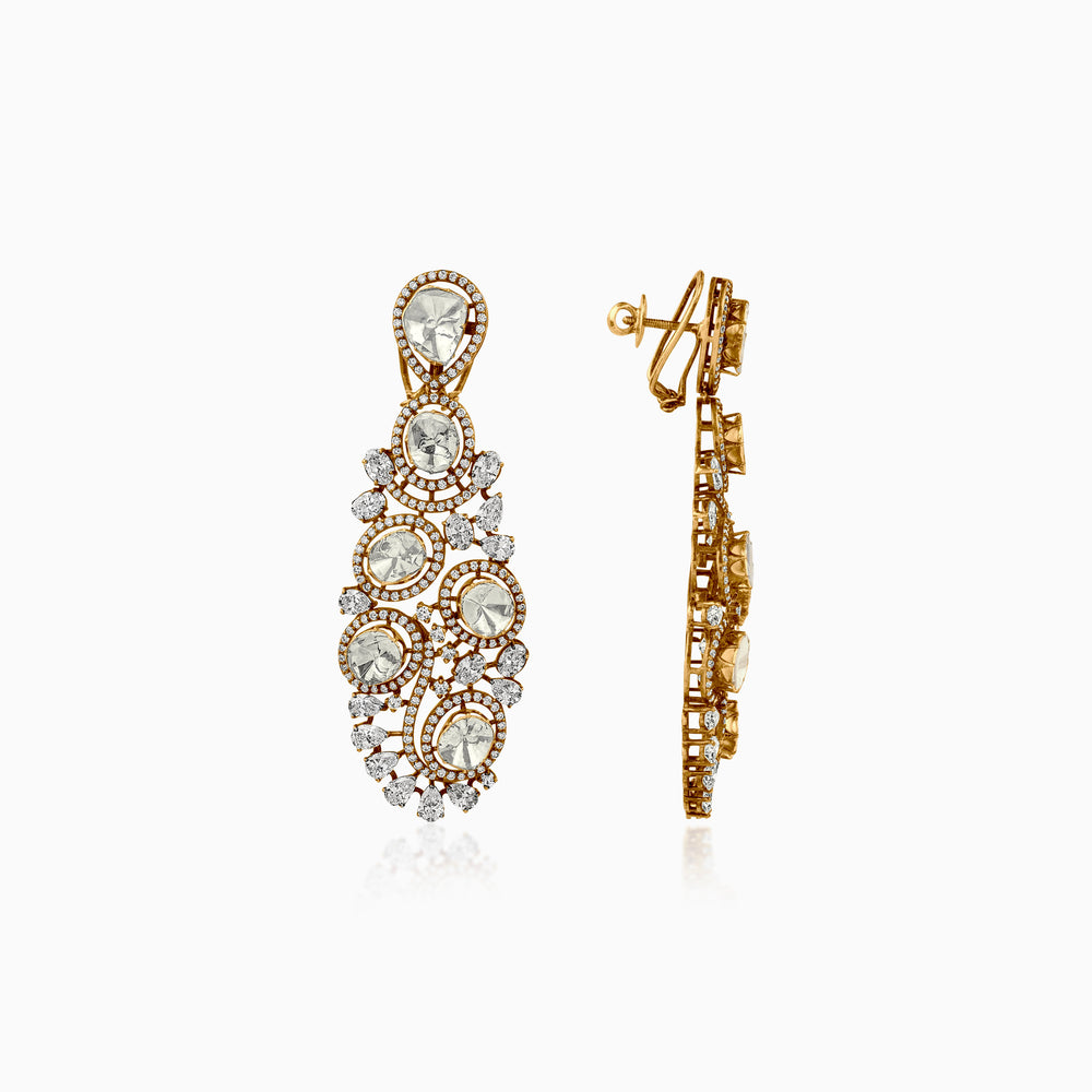 Ornate gold chandelier earrings with diamond-like stones in cascading circular design