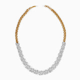 Gold and silver leaf-like necklace with intricate diamond cluster design