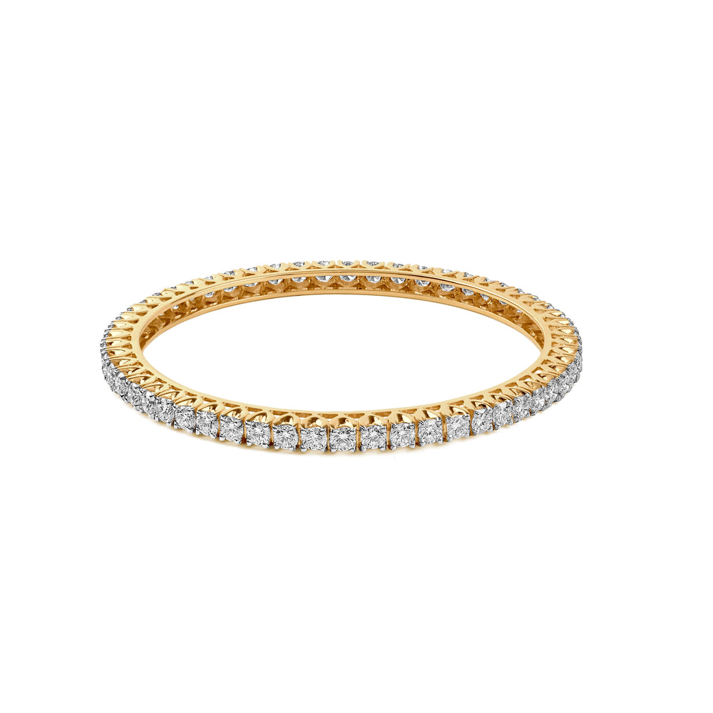 Delicate gold eternity band with diamond-encrusted border, sparkling from every angle.