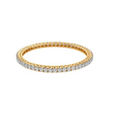 Delicate gold eternity band with diamond-encrusted border, sparkling from every angle.
