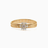 Gold bracelet with diamond snowflake-shaped centerpiece on textured band