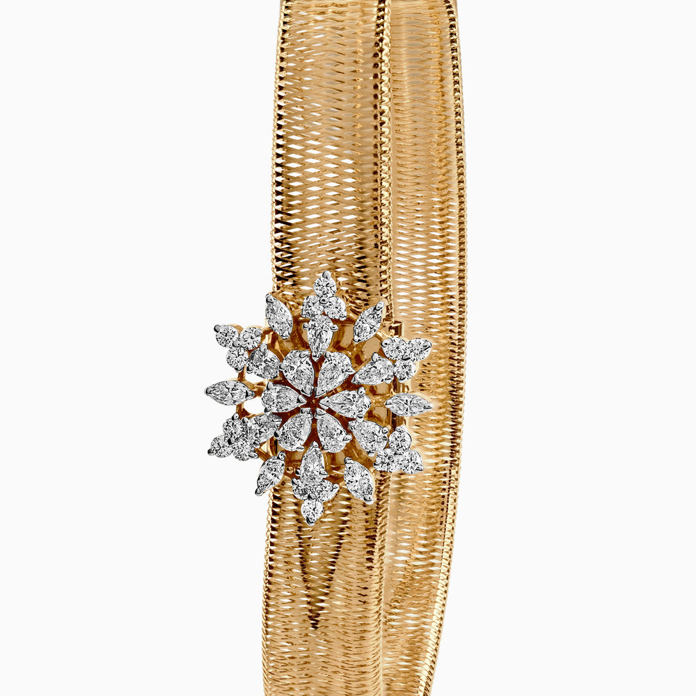 Diamond snowflake brooch on golden woven metallic background, intricate floral design