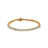 Gold tennis bracelet with diamond stones and secure clasp.