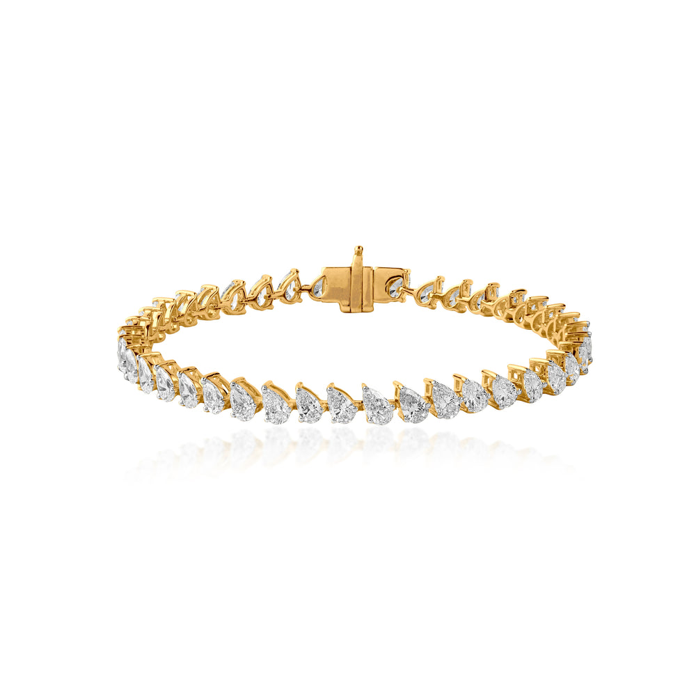 Gold tennis bracelet with pear-cut diamonds in elegant, interconnected design