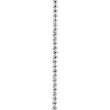 Vertical line of sparkling white diamonds against a white background