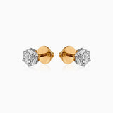 Pair of gold and silver diamond stud earrings with screw-back closure