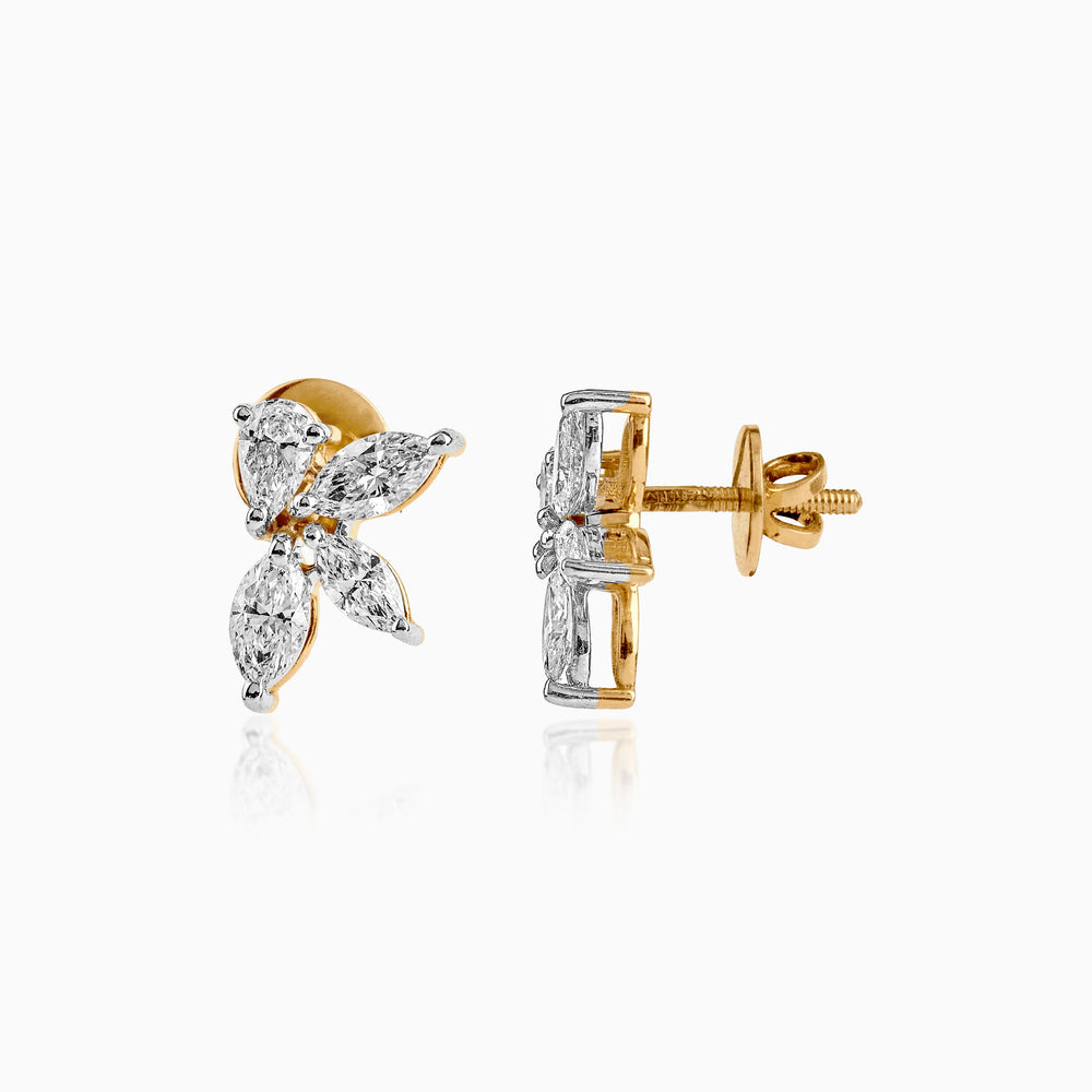 Gold and diamond butterfly-shaped stud earrings with marquise and pear-cut stones.