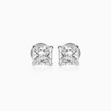 Princess-cut diamond stud earrings in silver, sparkling against white background