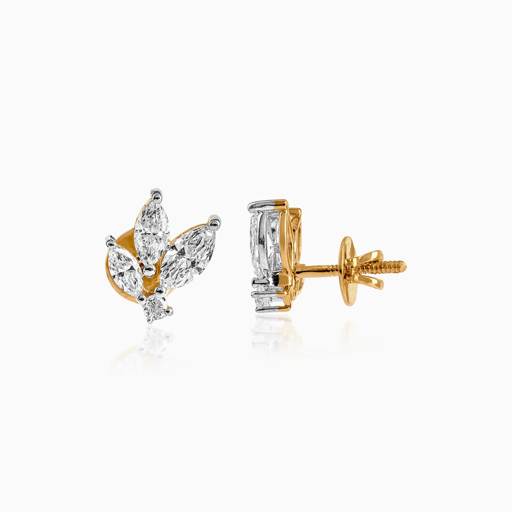 Gold and diamond leaf-shaped stud earrings with marquise-cut stones