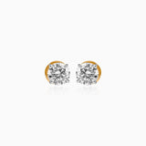 Gold-mounted round diamond stud earrings on white background