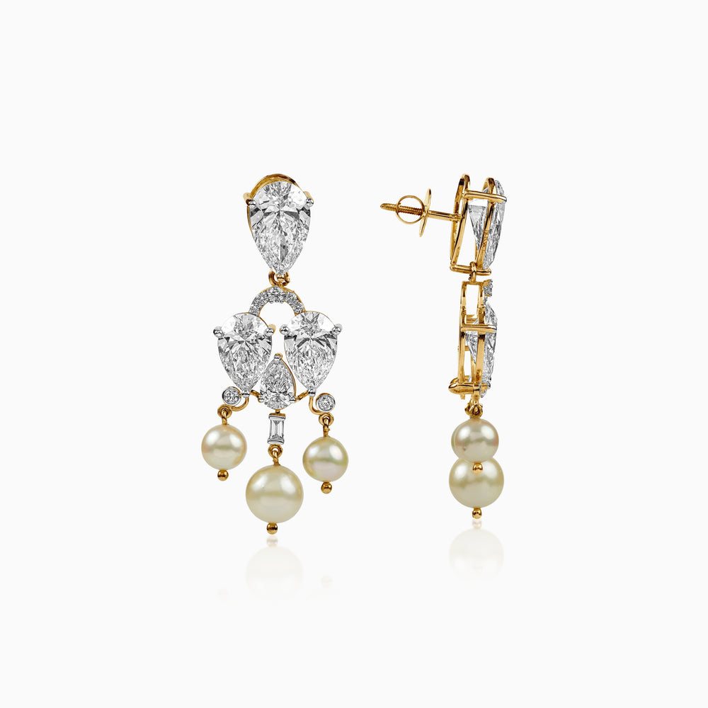 Diamond and pearl chandelier earrings in gold with pear-cut stones and hanging pearl drops