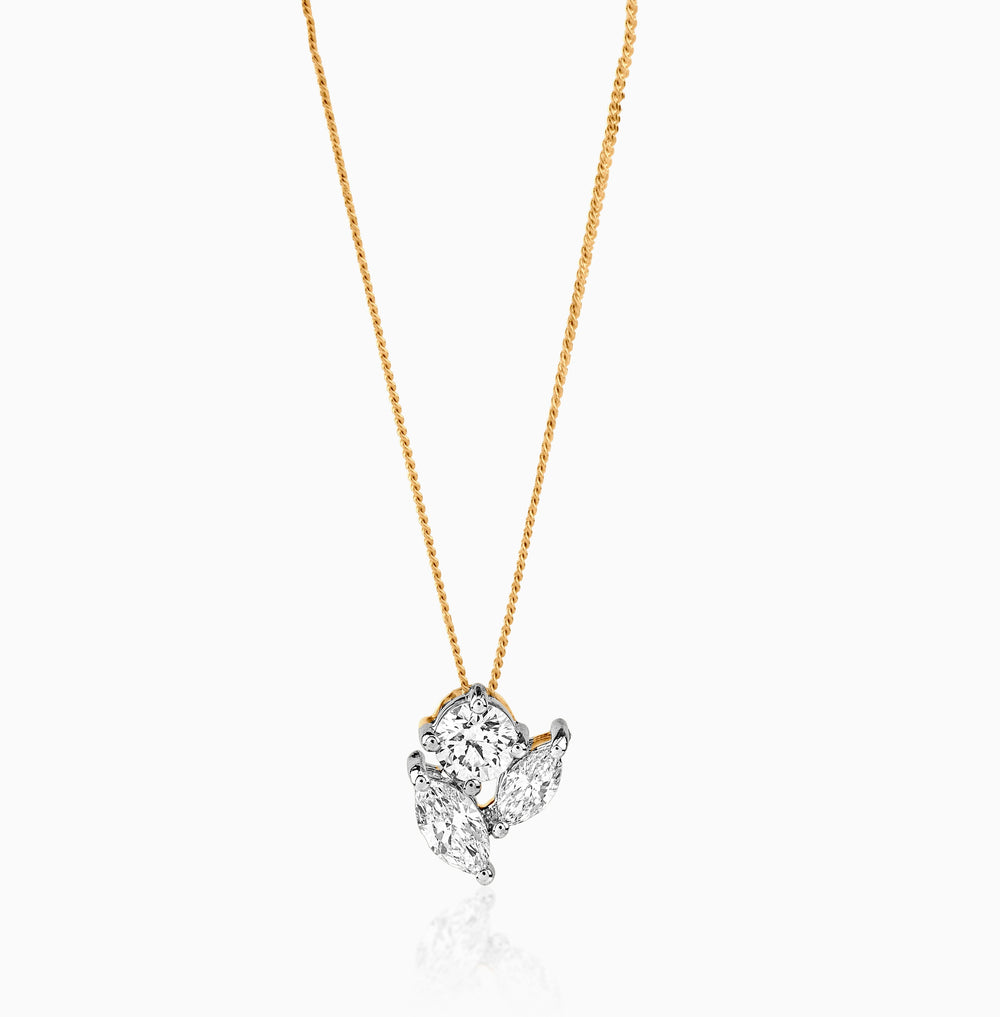 Gold chain with multi-diamond cluster pendant, delicate and sparkling against white background