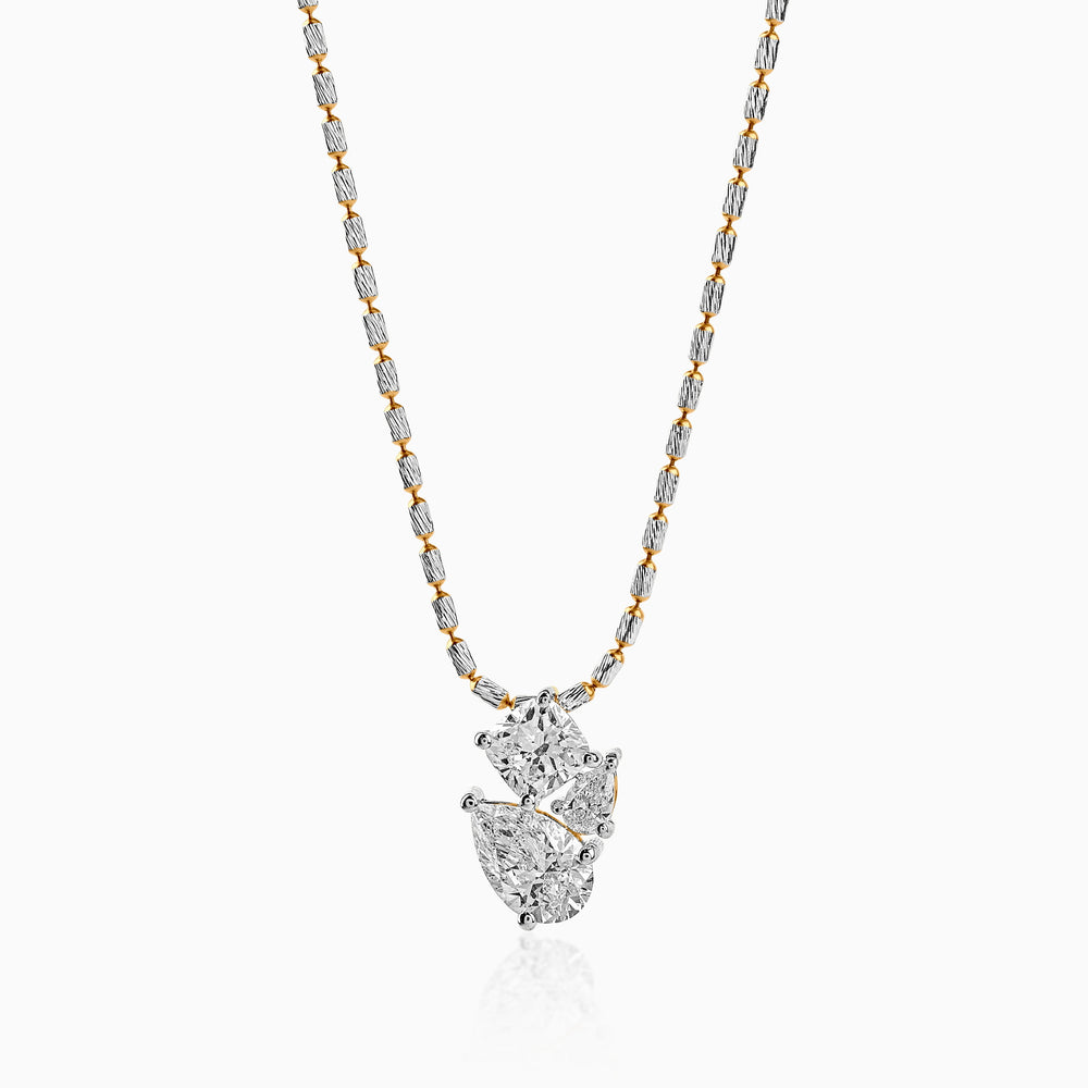 Two-toned diamond pendant necklace with silver and gold chain, sparkling cluster design
