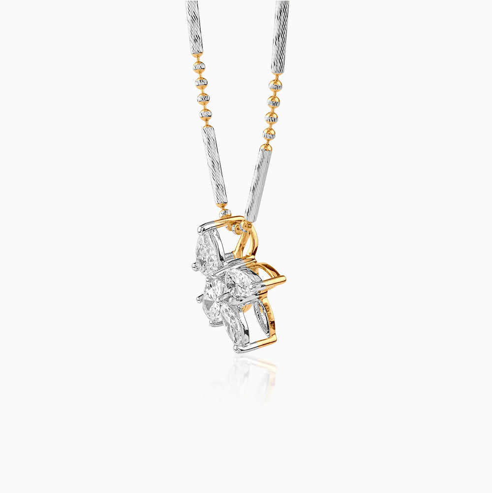 Gold and silver diamond pendant on twisted chain with floral cluster design