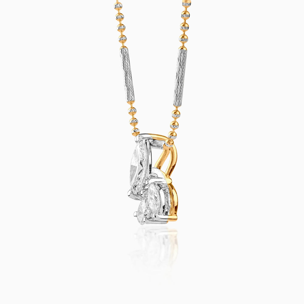 Gold and silver two-tone pendant with multiple diamonds on delicate chain
