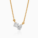 Gold chain necklace with two round and pear-shaped diamonds in white gold setting