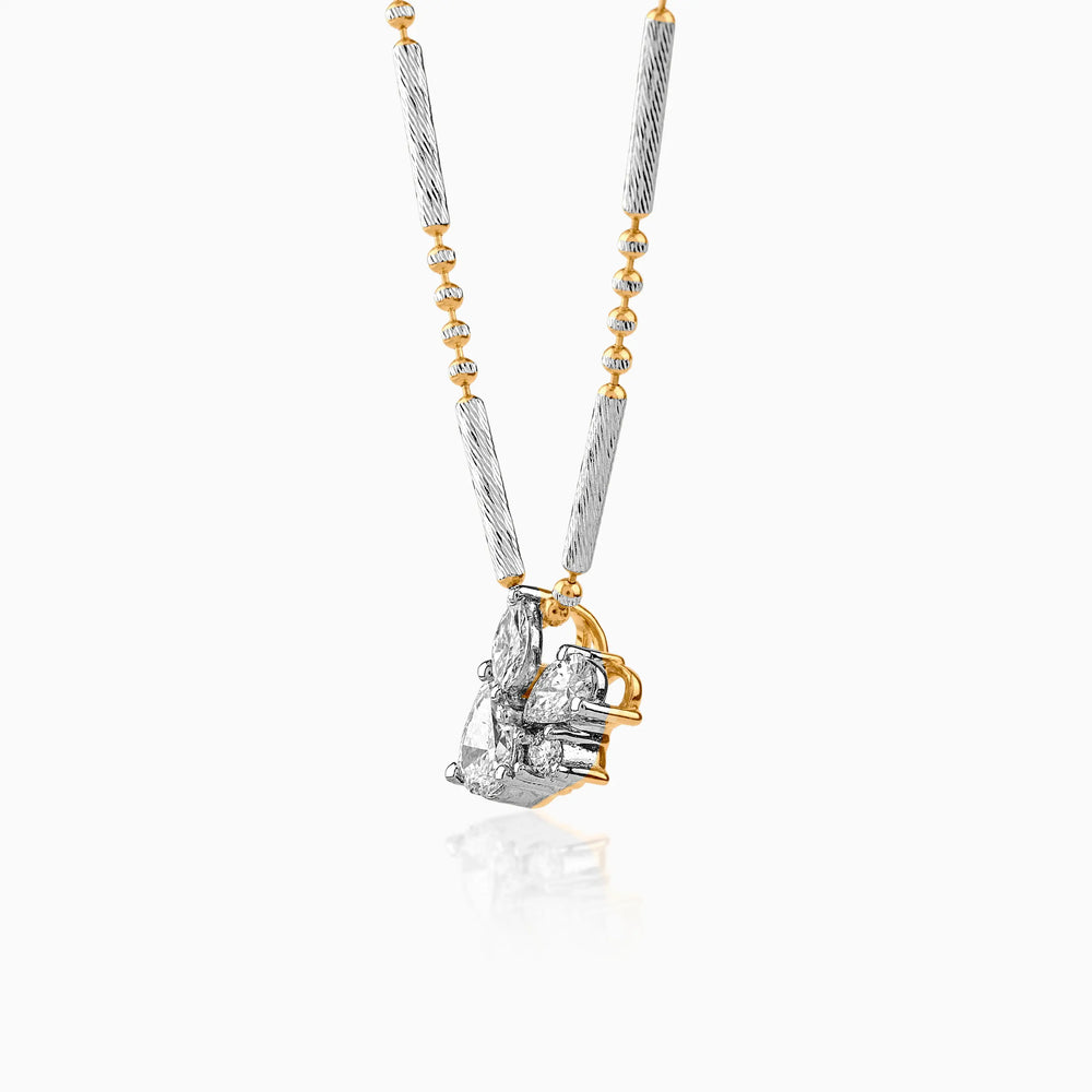Two-tone diamond pendant necklace with silver chain and gold accents, hanging vertically