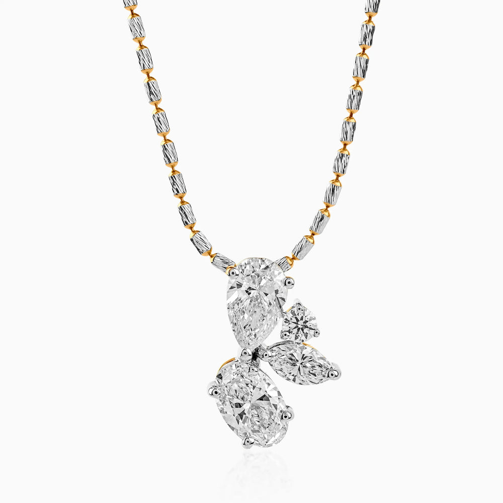 Gold and silver chain with diamond-studded pendant in mixed geometric shapes