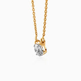 Gold necklace with solitaire diamond pendant, delicate chain and sparkling clear gemstone