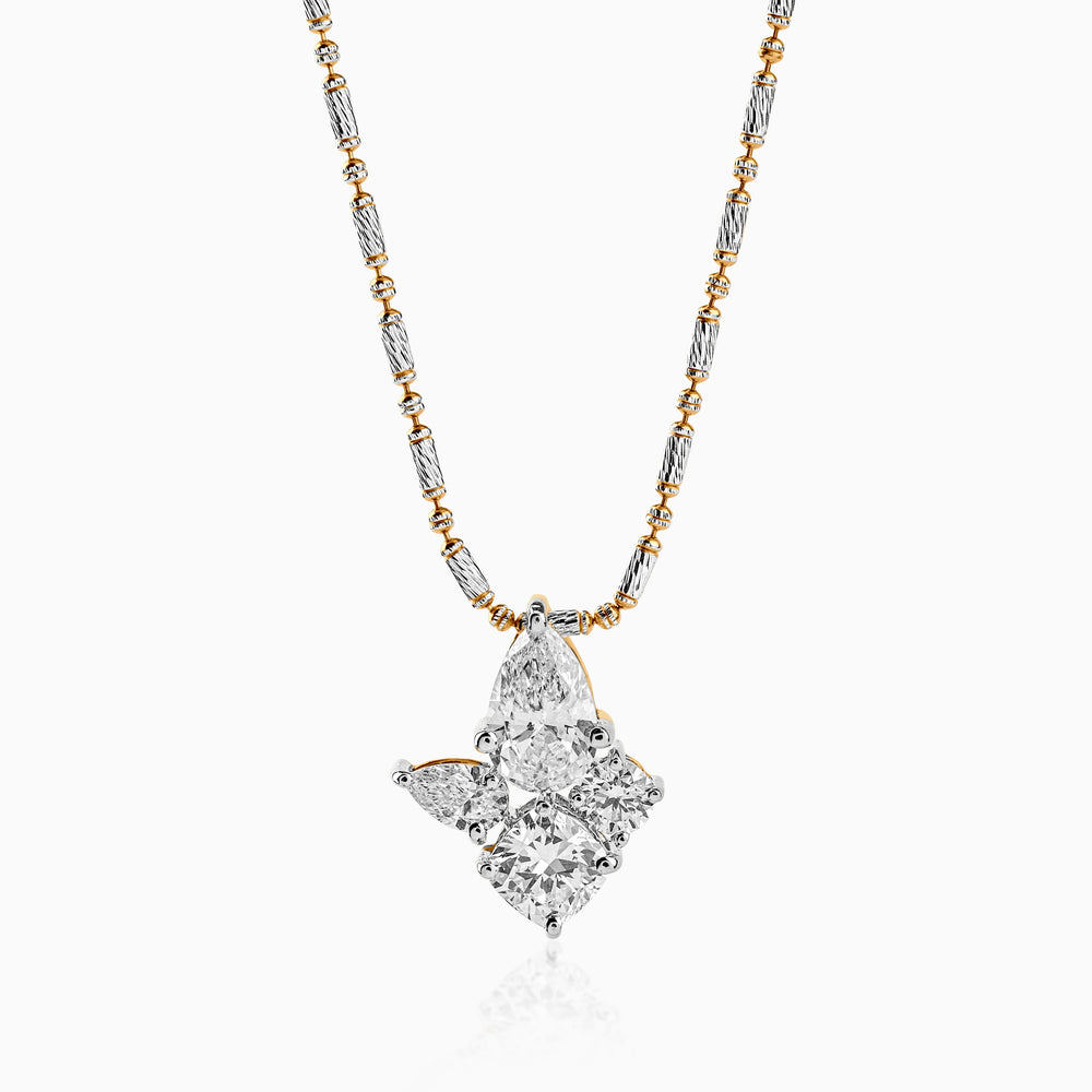 Two-tone gold and silver necklace with diamond cluster pendant in geometric star shape