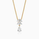 Gold chain with multi-diamond pendant, featuring teardrop and cluster diamond design.