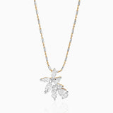 Diamond leaf pendant on two-tone gold and silver chain with delicate design