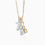 Diamond butterfly pendant on two-tone gold and silver chain with intricate design