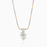 Two-tone necklace with multi-cut diamond pendant on mixed metal chain with gold and silver tones.
