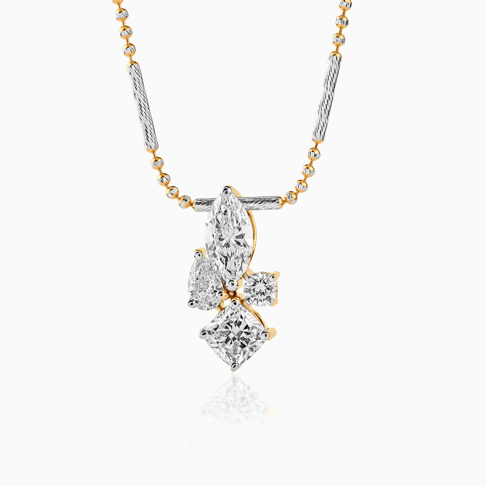 Diamond pendant with mixed-cut stones on two-tone chain, elegant and sparkling