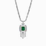 Emerald pendant with diamond-encrusted white gold necklace, ornate vintage design