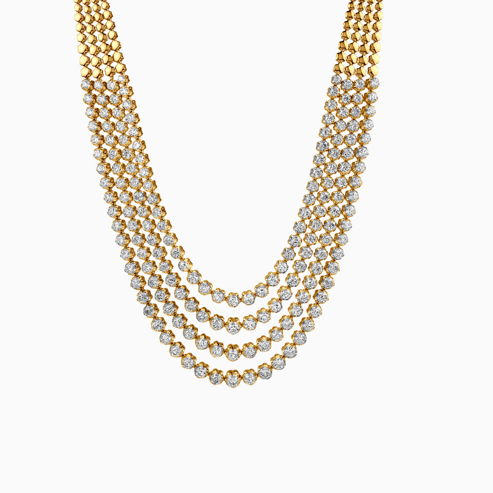 Layered gold necklace with sparkling diamond-studded strands in cascading design