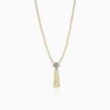 Pearl necklace with diamond-like pendant and delicate tassel design