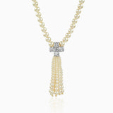 Pearl necklace with diamond cross pendant and cascading pearl tassel