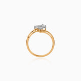 Gold ring with three clustered white diamonds on a delicate band