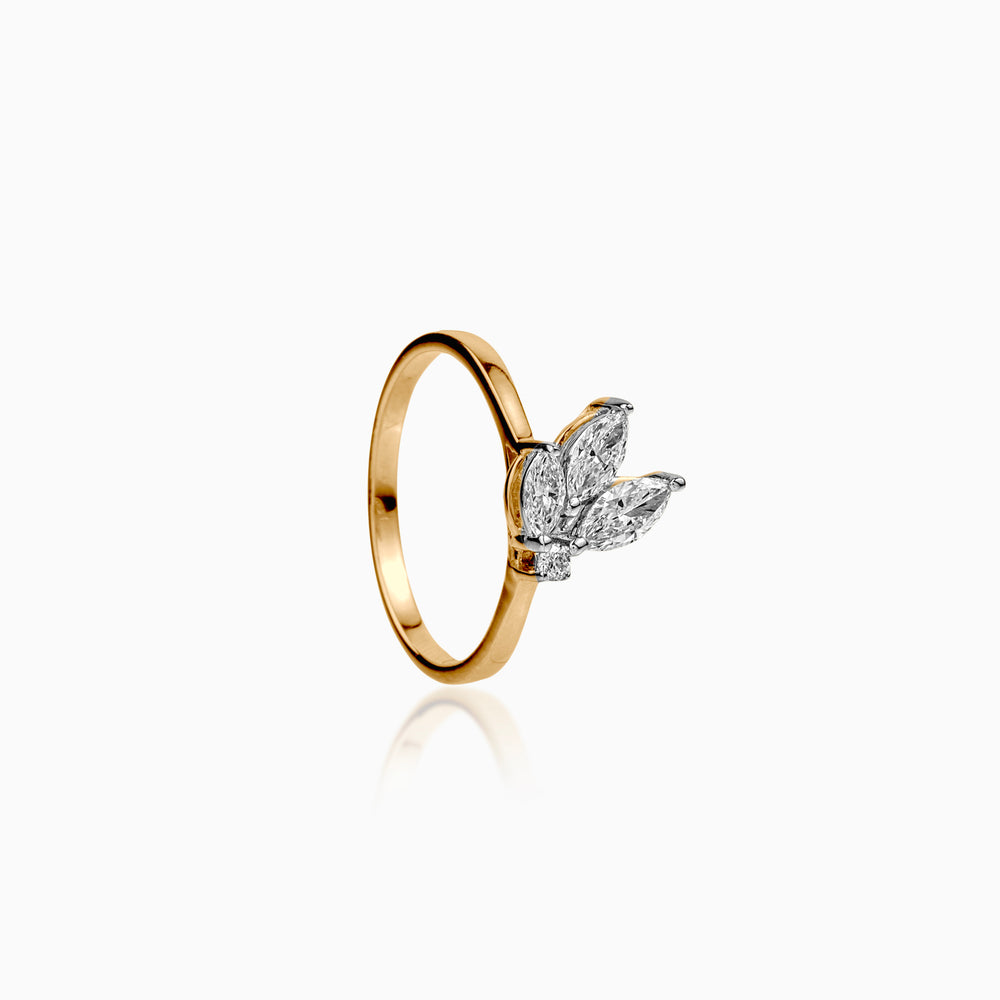 Gold ring with marquise diamond butterfly design on white background