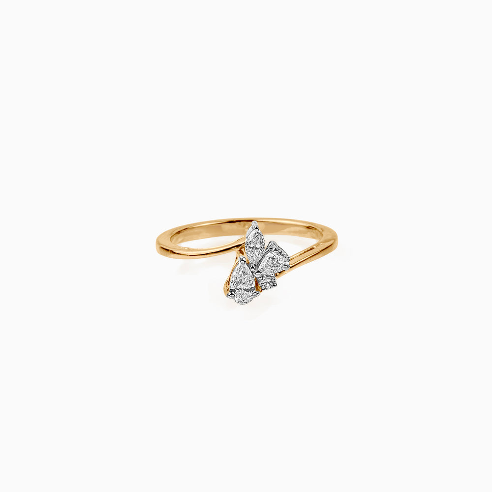 Gold ring with three pear-shaped diamonds clustered together on a curved band