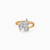 Gold ring with three uniquely cut white diamonds on elegant twisted band