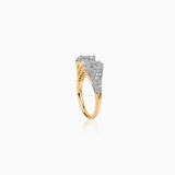 Gold ring with diamond stones and intricate filigree band on white background