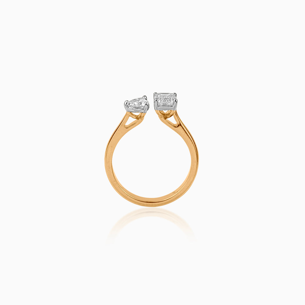 Gold ring with two different cut diamonds in white gold settings