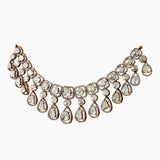 Elegant diamond statement necklace with teardrop and square-cut stones in gold setting