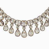 Elegant diamond and gold statement necklace with teardrop and square-cut gems