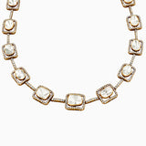 Gold necklace with diamond-studded square pendants and white stone centers
