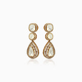 Gold drop earrings with pale stone centers, surrounded by sparkling diamond halos