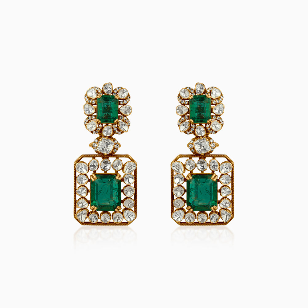 Emerald and diamond drop earrings in gold, ornate vintage-inspired design