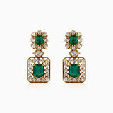 Emerald and diamond drop earrings in gold, ornate vintage-inspired design